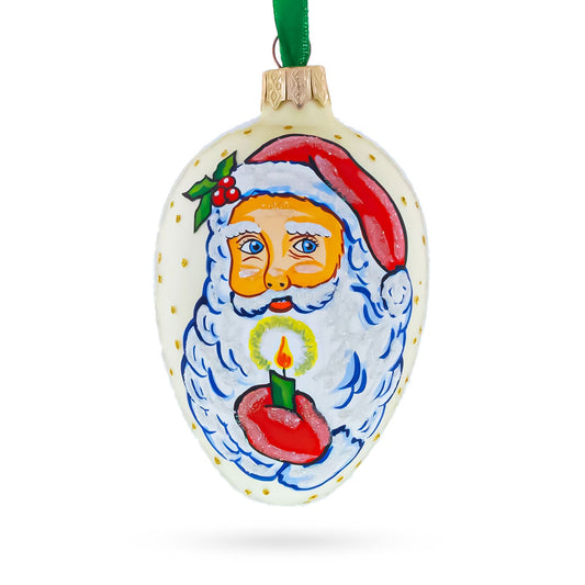 Santa Holding Candle Glass Egg Ornament 4 Inches